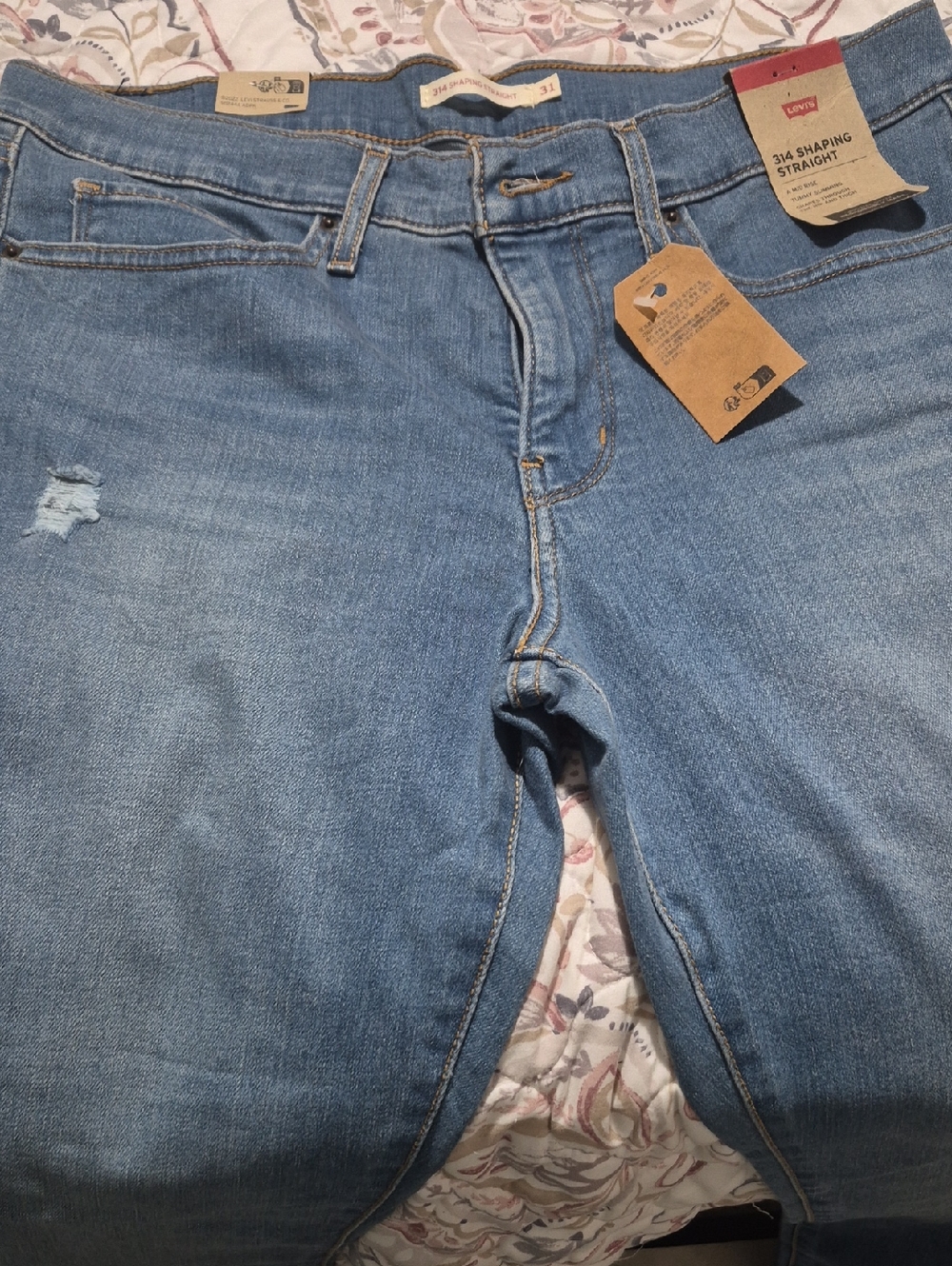 Levi's Women's Straight Leg Jeans in Blue with Light Distress